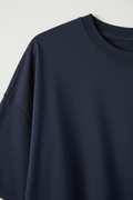 Dark blue oversized t-shirt - close-up fabric texture and crew neck detail