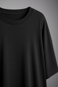 Black oversized t-shirt - close-up fabric texture and crew neck detail