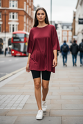 Wine red oversized t-shirt - woman wearing streetwear style with bike shorts