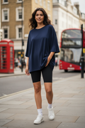 Dark blue oversized t-shirt - woman wearing streetwear style with bike shorts