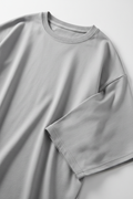 Gray oversized t-shirt - close-up fabric texture and crew neck detail
