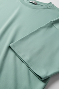 Water green oversized t-shirt - close-up fabric texture and crew neck detail